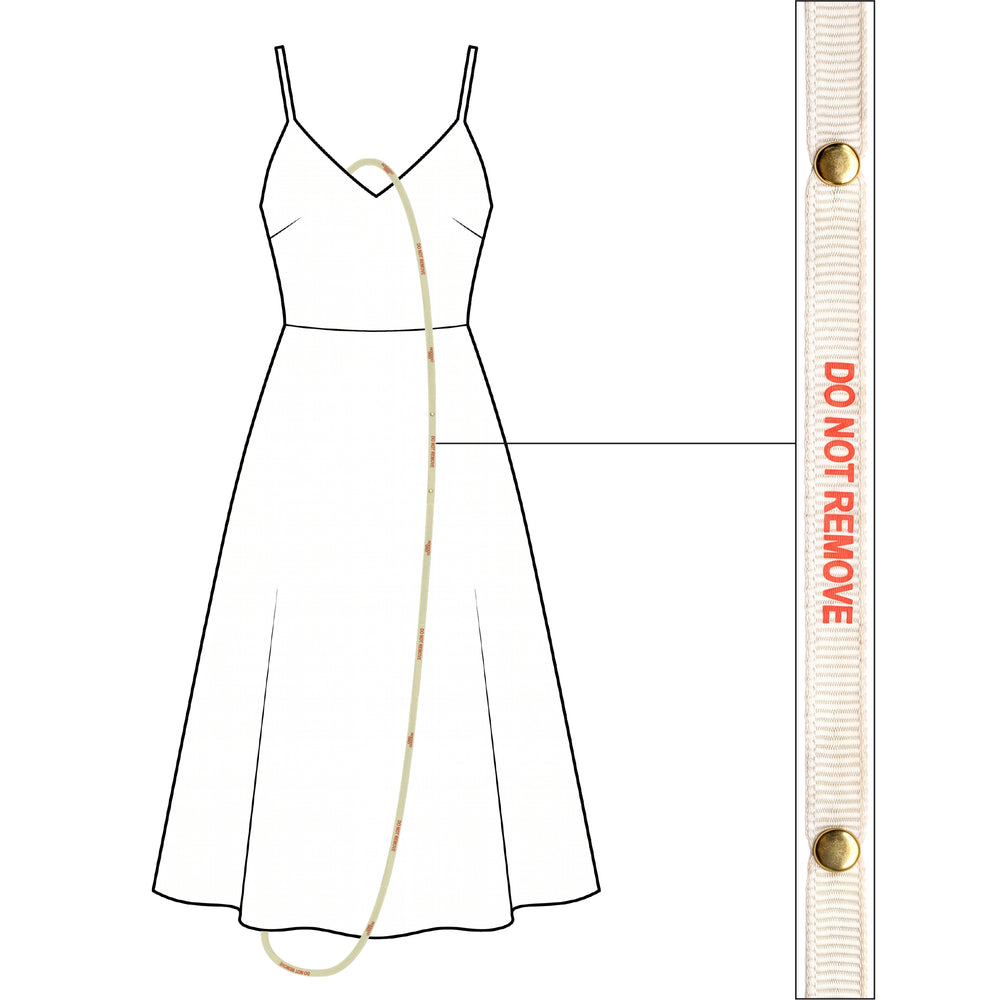 Do Not Remove ribbon threaded through a slip dress, with a close-up of the ribbon
